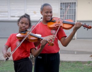 Sisters hooked on violin, karate